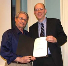 Eric Bradley receives the Faculty Governance Award from Dean Carl Strikwerda